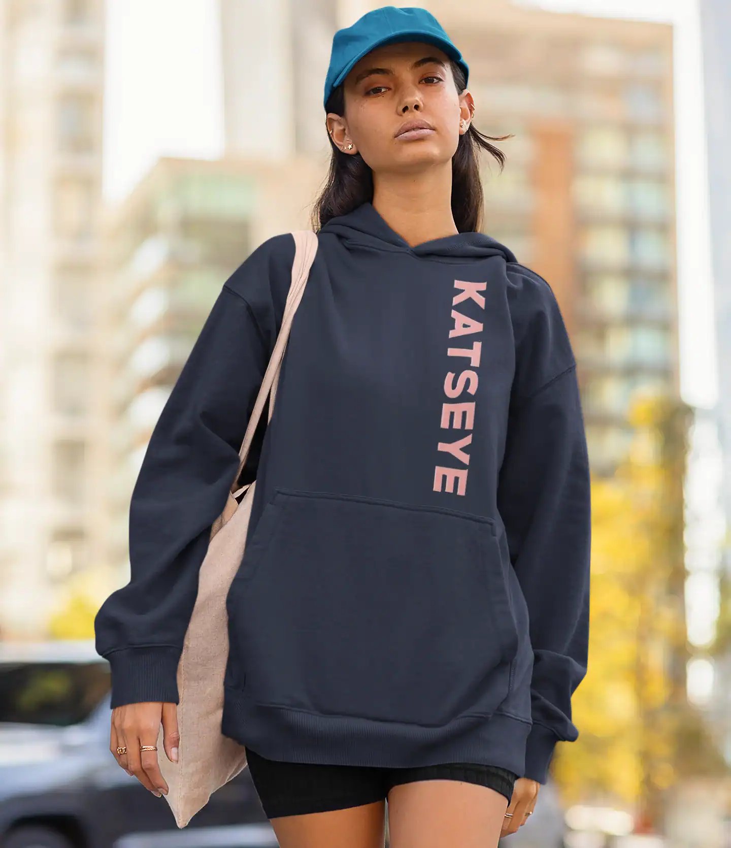 model wearing blue katseye unisex hoodie