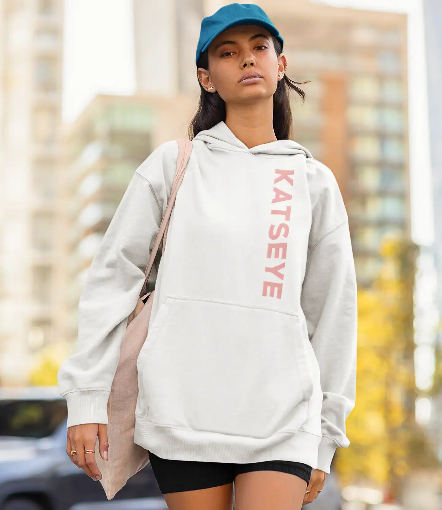 model wearing white katseye unisex hoodie